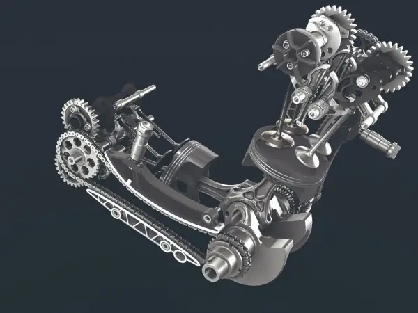 Mechanizm silnika z widocznym tłokiem, zaworami i łańcuchem napędowym. To serce maszyny, jej rozrząd królewski.